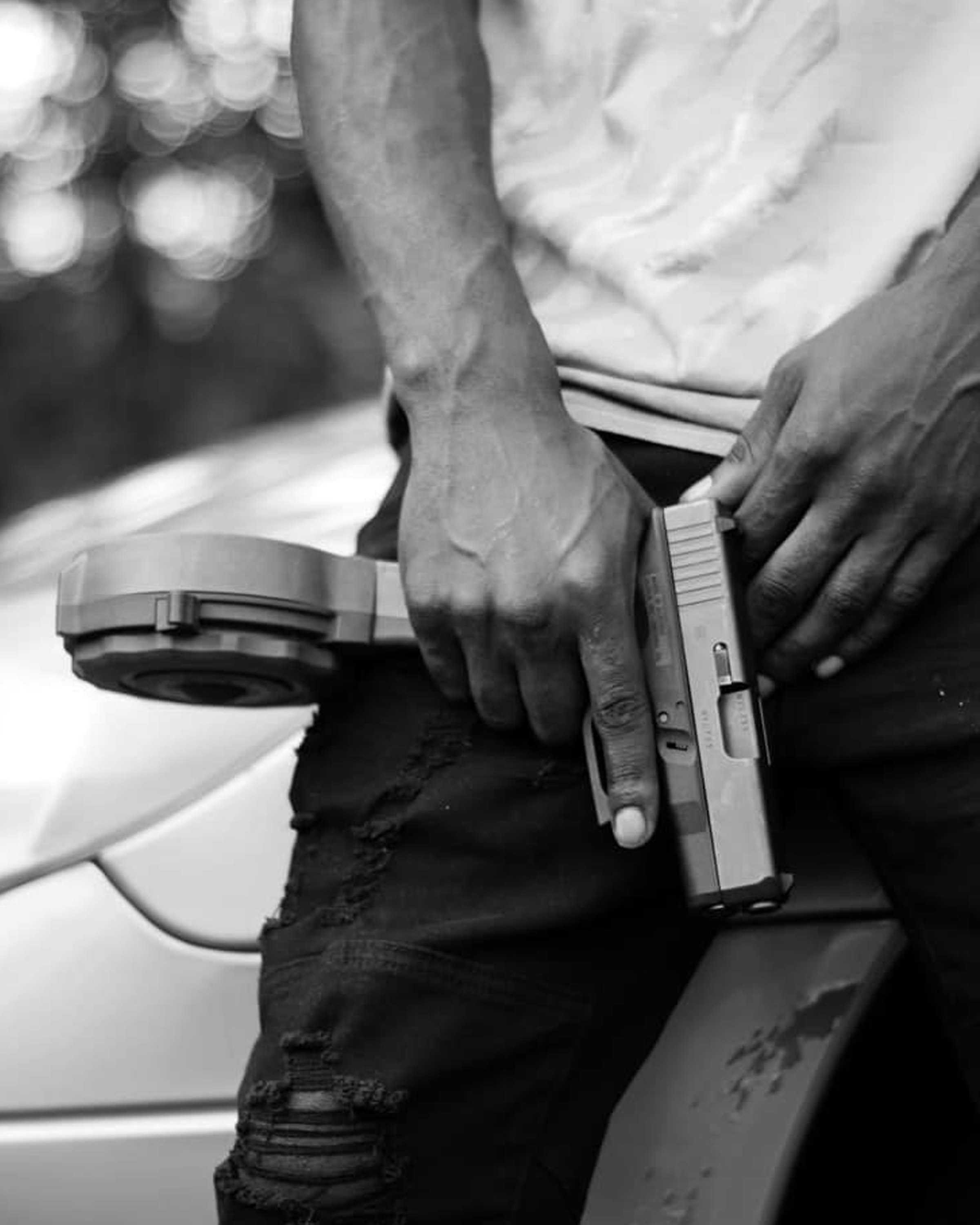 grayscale photo of person holding a device